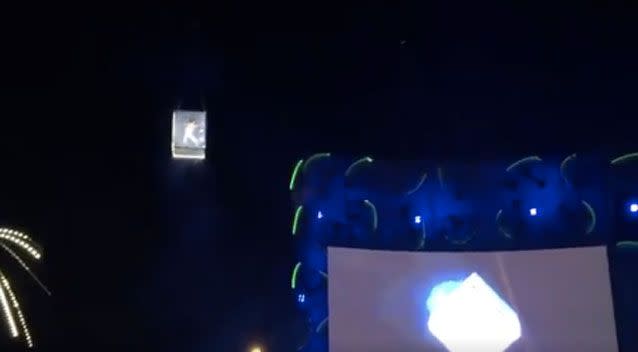 The performer was suspended in an illuminated box at the Mad Cool Festival on Friday. Photo: Twitter/ Kostarof