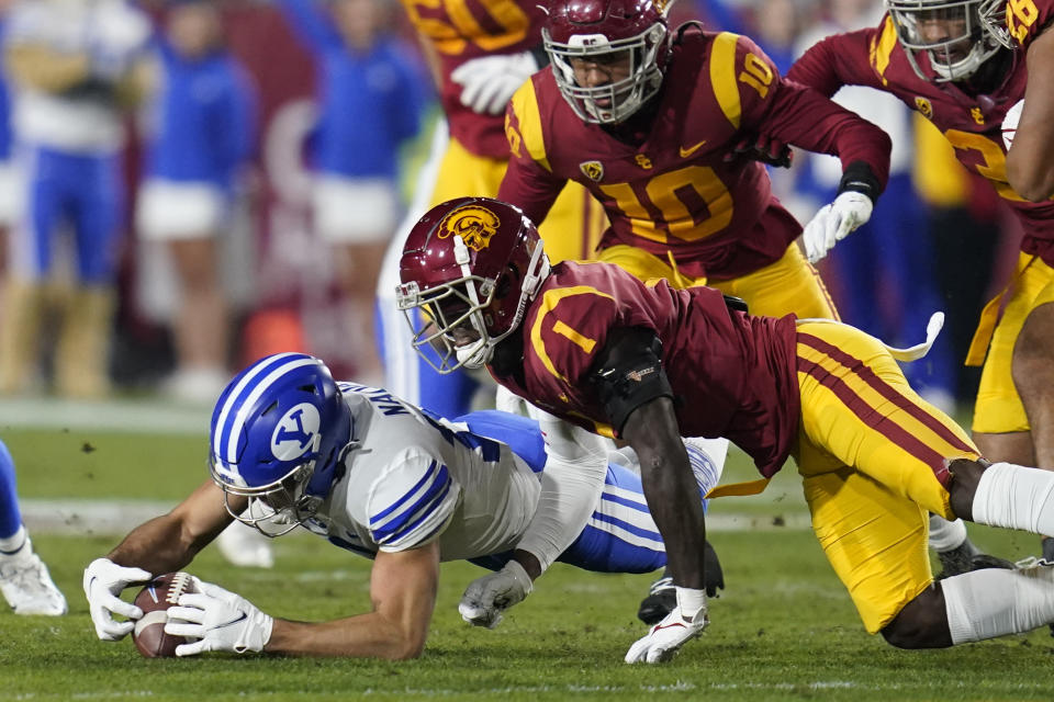 DUPLICATE***Brigham Young wide receiver Puka Nacua (12) recovers a fumble during the first half of an NCAA college football game against Southern California in Los Angeles, Saturday, Nov. 27, 2021. (AP Photo/Ashley Landis)