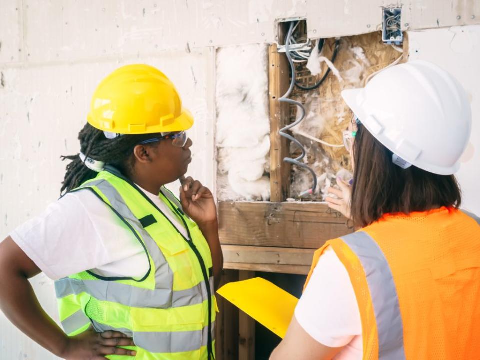 Two inspectors reviewing a potential safety hazard