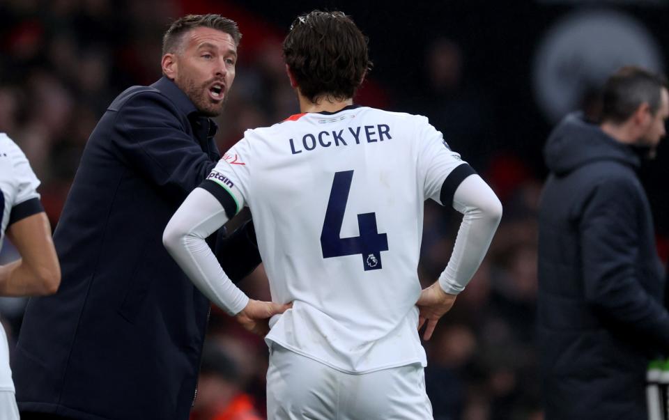 Luton Town manager Rob Edwards (left) talks to his captain Tom Lockyer