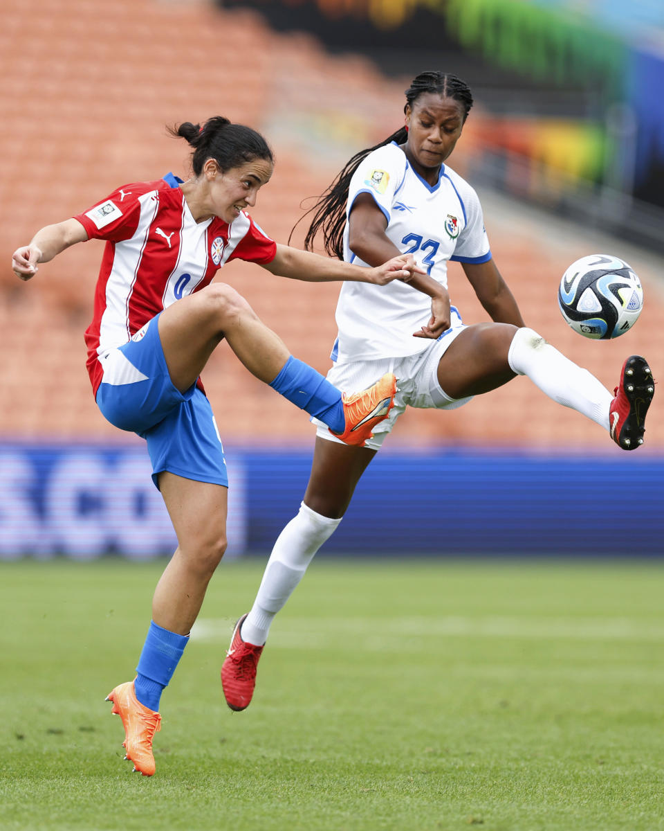 Carina Baltrip-Reyes, right, of Panama and Lice Chamorro of Paraguay battle for the ball during their FIFA women's World Cup qualifier in Hamilton, New Zealand, Thursday, Feb. 23, 2023. (Martin Hunter/Photosport via AP)