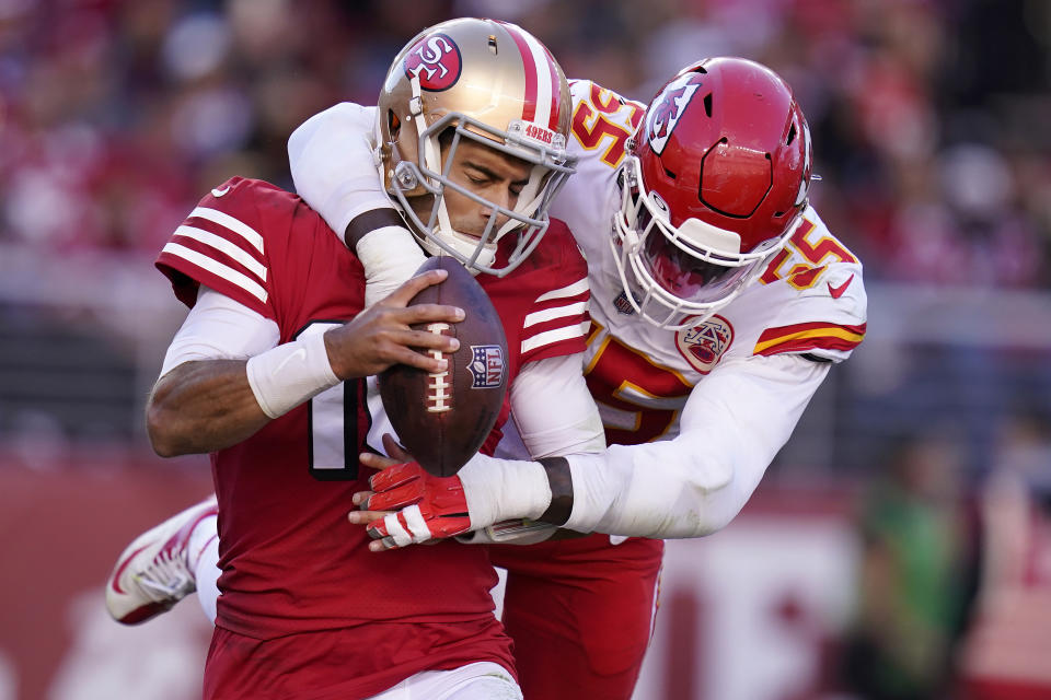 San Francisco 49ers quarterback Jimmy Garoppolo, left, is sacked by Kansas City Chiefs defensive end Frank Clark for safety during the second half of an NFL football game in Santa Clara, Calif., Sunday, Oct. 23, 2022. (AP Photo/Godofredo A. Vásquez)