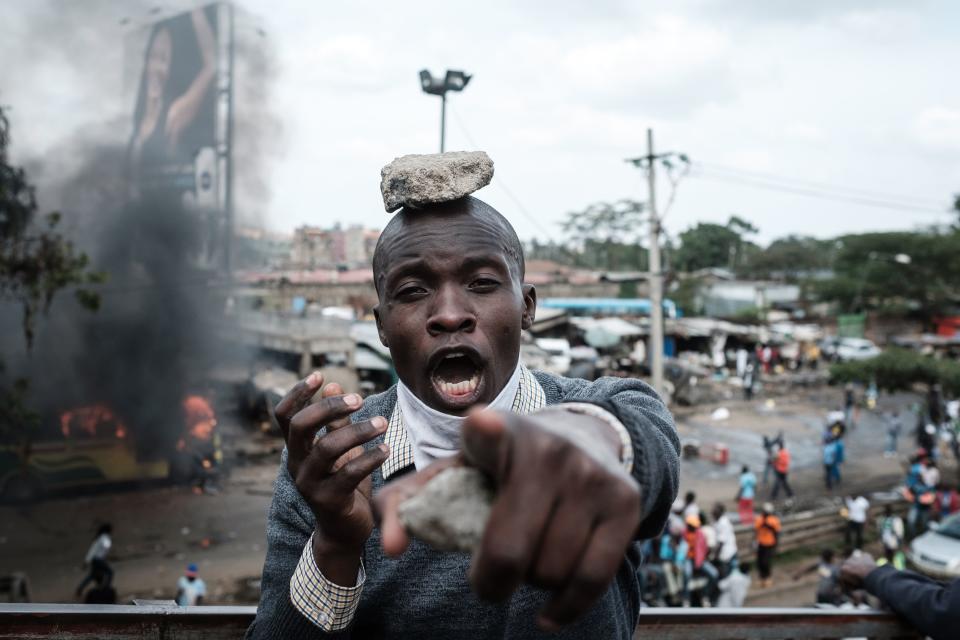 <p>A supporters of Kenyan’s opposition party National Super Alliance (NASA) reacts during a demonstration following the arrival of opposition leader Raila Odinga to the Jomo Kenyatta Internation airport on Nov. 17, 2017 in Nairobi. (Photo: Yasuyoshi Chiba/AFP/Getty Images) </p>