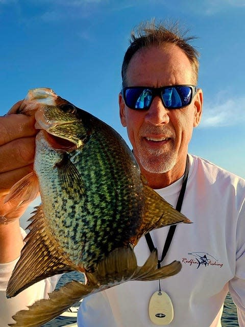 John Patterson normally fishes the St. Johns for sunshine bass but brought in this speck using a large jerk bait.