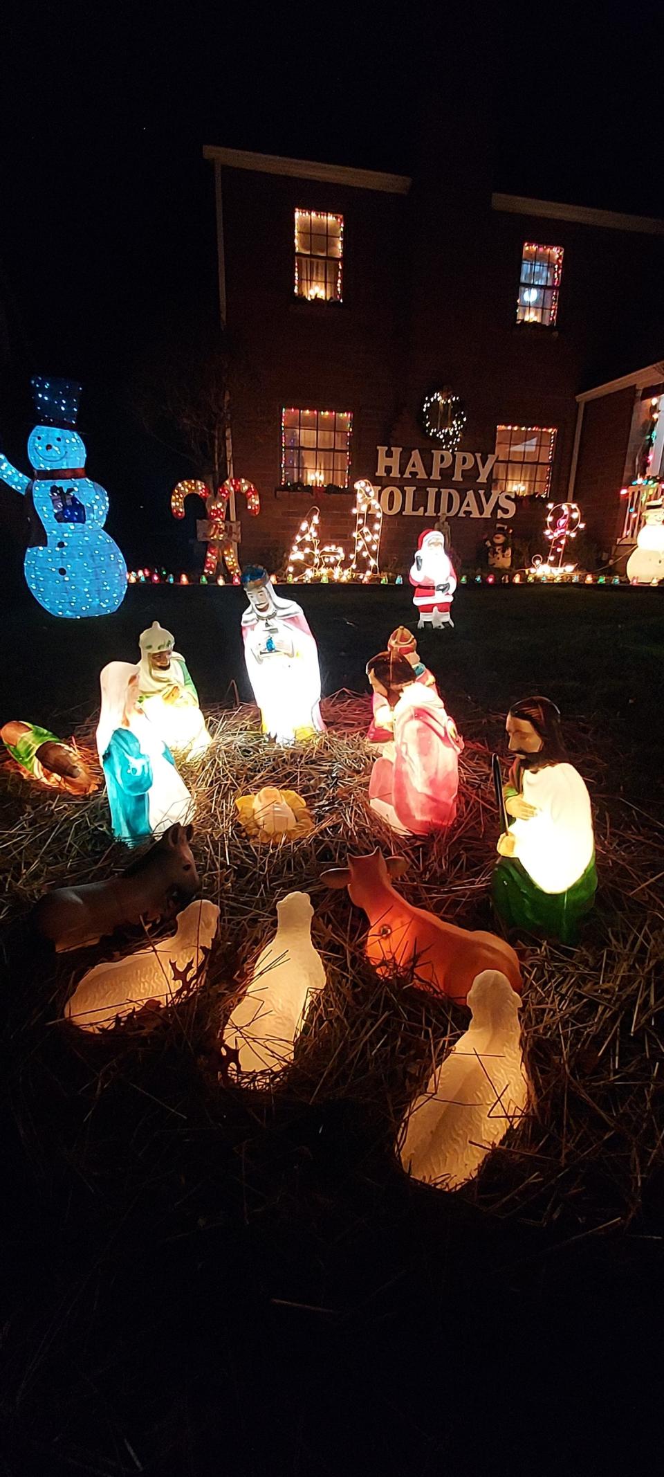 The Melfi family yard lit up with Christmas decorations in Ellwood City.