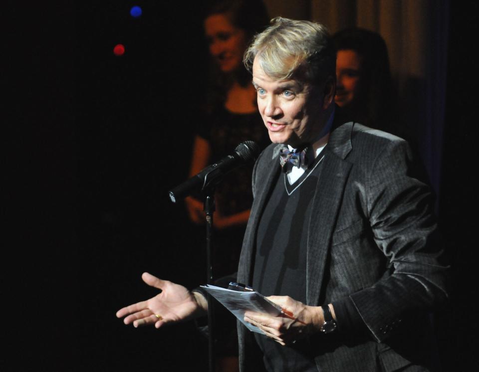 Ray Kennedy accepts the award for Best Director of a Musical for Opera House Theatre Co.'s production of "Oklahoma!" at the Wilmington Theater Awards at Thalian Hall in 2014.