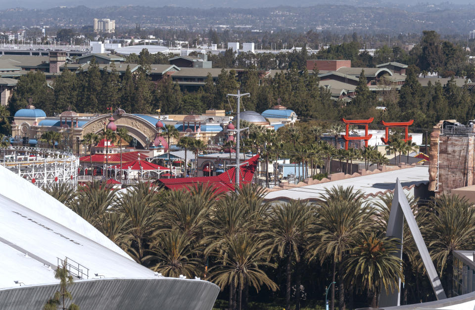 A view of Disneyland's amusement park lot is seen through a window in Anaheim, Wednesday, April 17, 2024. Workers who help bring Disneyland's beloved characters to life said Wednesday they collected enough signatures to support their push for a union. (AP Photo/Damian Dovarganes)