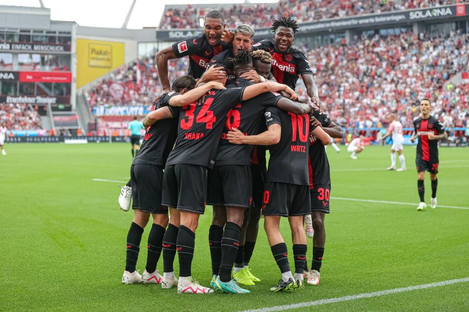 bayer leverkusen players celebrate a goal in the bundesliga