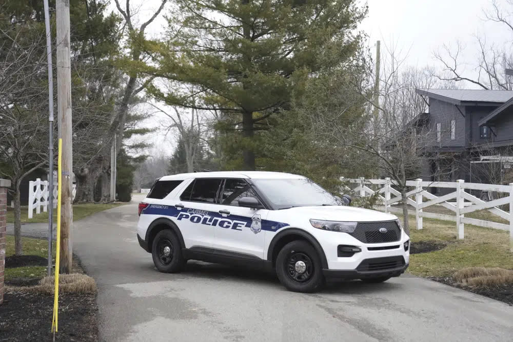 Police secure the entrance to the neighborhood of former Vice President Mike Pence’s Indiana home, Friday, Feb. 10, 2023 in Carmel, Ind. (AP Photo/Michael Conroy)