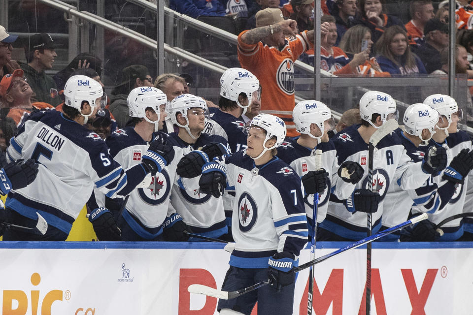 Winnipeg Jets' Vladislav Namestnikov (7) celebrates a goal with the team bench against the Edmonton Oilers during the second period of an NHL hockey game in Edmonton, Alberta, Saturday, Oct. 21, 2023. (Jason Franson/The Canadian Press via AP)