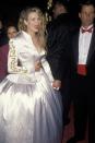 <p> The star arrived to the 1990 Academy Awards in a white gown with one shoulder ripped off and a corseted bodice. The look did not seem comfortable at all. </p>