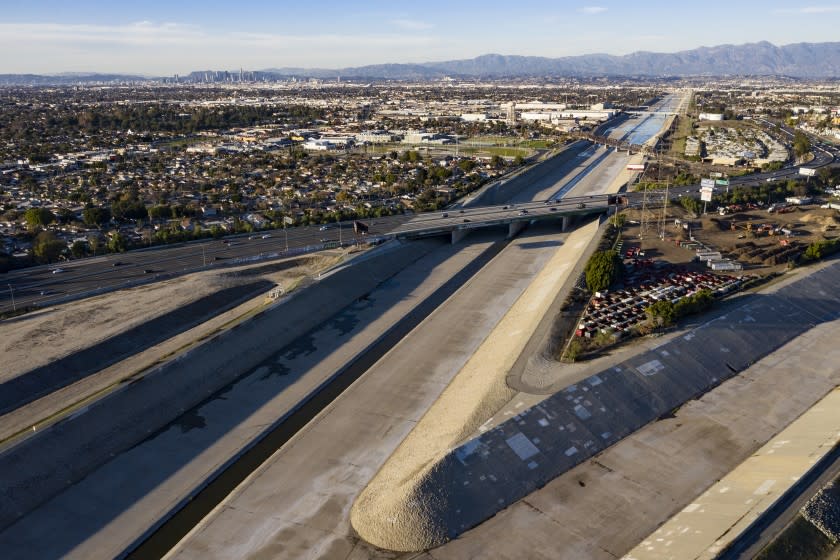 SOUTH GATE, CA - JANUARY 10: View towards what would be the Confluence Point Park, right, and LA River Platform Park, left, where Los Angeles River and Rio Hondo converge on Sunday, Jan. 10, 2021 in South Gate, CA. (Brian van der Brug / Los Angeles Times)