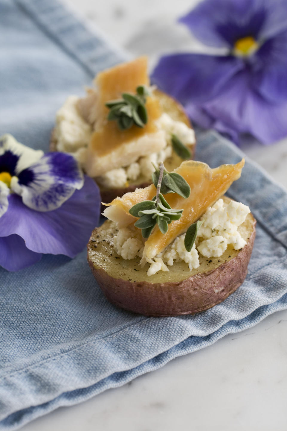 In this image taken on Appil 22, 2013, smoked schmeared potatoes are shown in Concord, N.H. (AP Photo/Matthew Mead)