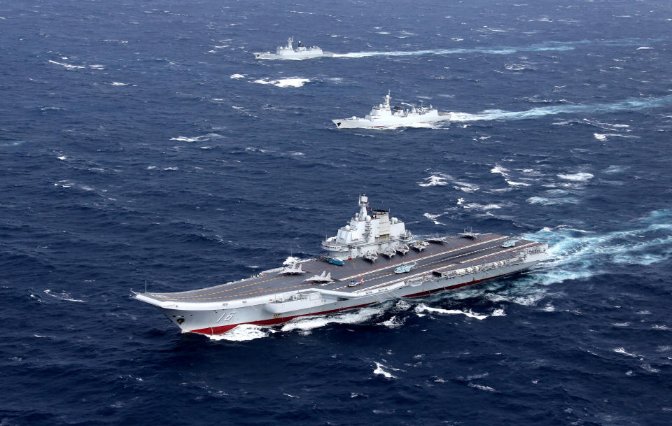 FILE PHOTO: China's Liaoning aircraft carrier with accompanying fleet conducts a drill in an area of South China Sea, in this undated photo taken December, 2016. REUTERS/Stringer/File photo ATTENTION EDITORS - THIS IMAGE WAS PROVIDED BY A THIRD PARTY. EDITORIAL USE ONLY. CHINA OUT TPX IMAGES OF THE DAY