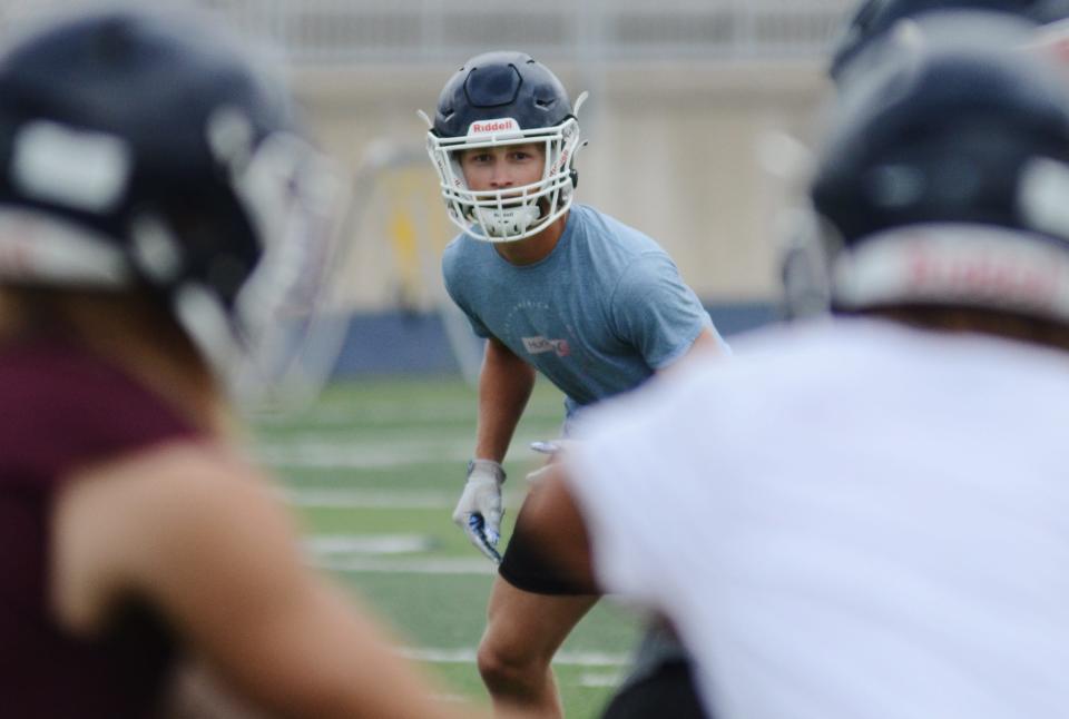 Petoskey safety Trevor Swiss keeps his eyes in the backfield during team drills Monday.