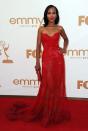 <p>Kerry Washington matched the 2011 Emmys red carpet in 2011, in this strapless scarlet Zuhair Murad dress with a full, sheer skirt. She finished the impactful look with a matching red clutch bag and bold lip. The actress had just landed the role of Olivia Pope in Scandal, which was due to air the following year. </p>