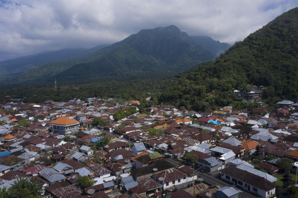 The center of Les, Bali, Indonesia is seen on April 11, 2021. The saltwater aquarium fishing town is tucked between the mountains and ocean in northern Bali. (AP Photo/Alex Lindbloom)