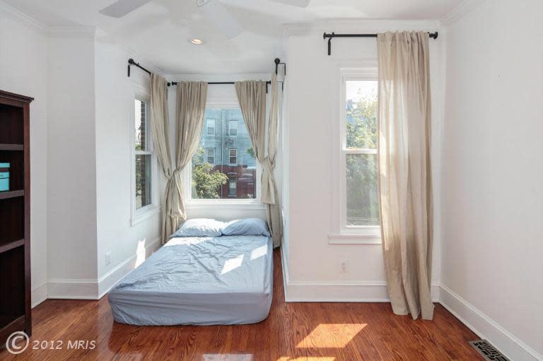 Another view of the larger bedroom. Last photo: A view of the smaller bedroom.