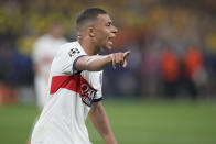 PSG's Kylian Mbappe gestures during the Champions League semifinal first leg soccer match between Borussia Dortmund and Paris Saint-Germain at the Signal-Iduna Park stadium in Dortmund, Germany, Wednesday, May 1, 2024. (AP Photo/Matthias Schrader)