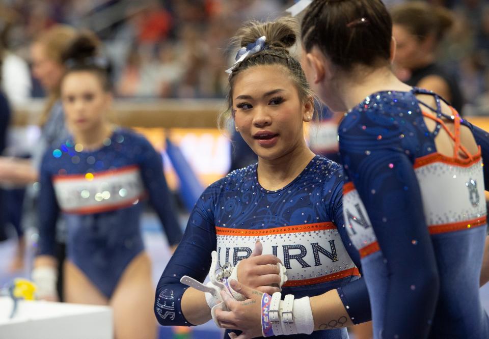 Auburn's Suni Lee prepares for her bar routine as Auburn Tigers gymnastics takes on Florida Gators at Neville Arena in Auburn, Ala., on Saturday, March 5, 2022. Auburn Tigers and Florida Gators ended in a tie at 198.575.