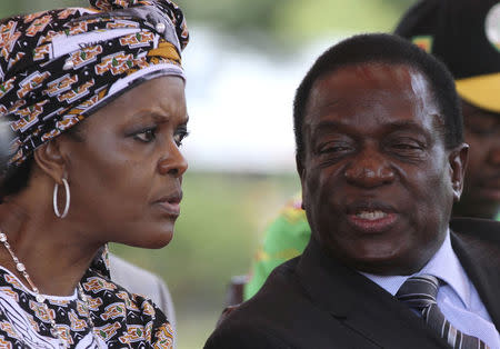 FILE PHOTO: Zimbabwe's President Robert Mugabe's wife Grace talks to Vice President Emmerson Mnangagwa at a gathering of the ZANU-PF party's top decision making body, the Politburo, in the capital of Harare, Zimbabwe February 10, 2016. Picture taken February 10, 2016. REUTERS/Philimon Bulawayo/File Photo