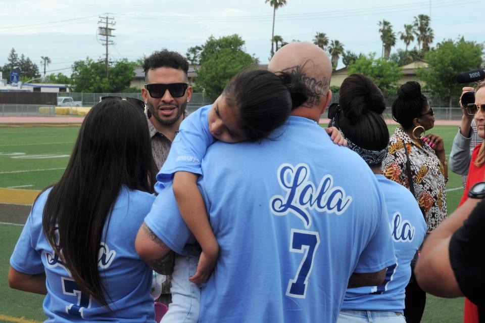 Alycia "Lala" Reynaga's family talked with Jason Lee after the special assembly in honor of their daughter concluded at Amos Alonzo Stagg High School. Reynaga, a 15-year-old Stagg freshman, was fatally stabbed on campus on April 18.