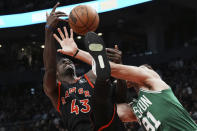 Toronto Raptors forward Pascal Siakam (43) and Boston Celtics forward Blake Griffin (91) vie for the rebound during the second half of an NBA basketball game in Toronto, Monday, Dec. 5, 2022. (Chris Young/The Canadian Press via AP)