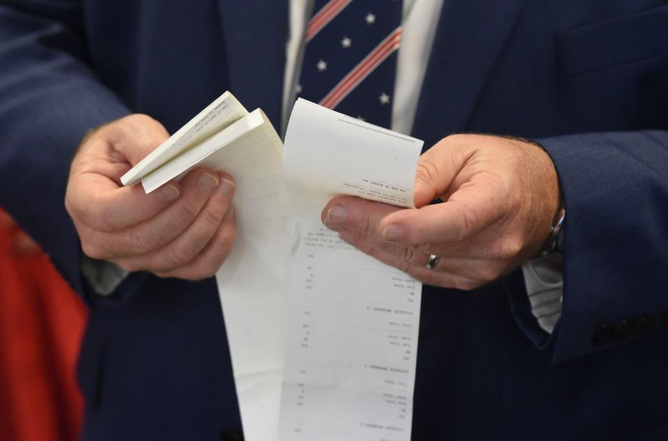 Tuscaloosa County Probate Judge Rob Robertson verifies the voting machine totals for each polling station at the Tuscaloosa County Courthouse Annex Auditorium Tuesday, Nov. 8, 2022.