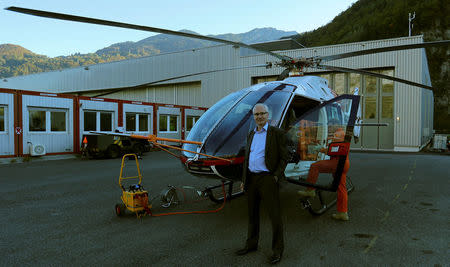 Chief Executive Andreas Loewenstein of Swiss helicopter manufacturer Marenco stands in front of a prototype of a Marenco SH09 helicopter at the company's plant in Mollis, Switzerland October 13, 2017. REUTERS/Arnd Wiegmann