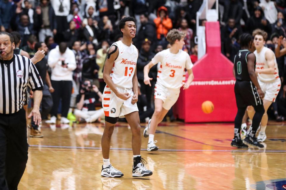 Birmingham Brother Rice guard Warren Marshall (13) celebrates a 3-point basket against Detroit Cass Tech  during overtime at Calihan Hall in Detroit on Friday, March 3, 2023.