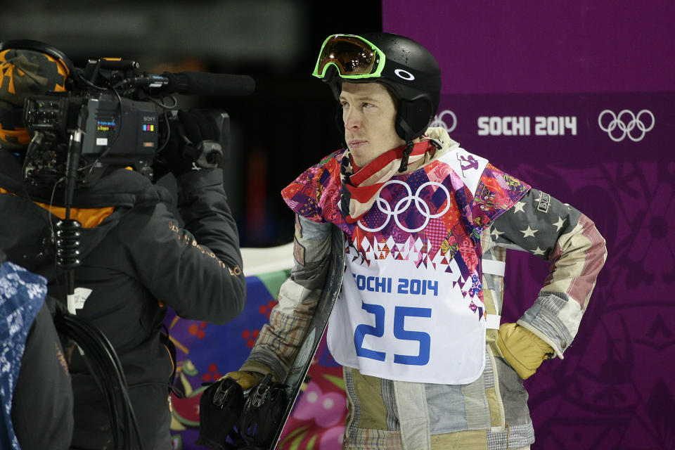 Shaun White, of the United States, looks at the scoreboard after competing in the men's snowboard halfpipe final at the Rosa Khutor Extreme Park, at the 2014 Winter Olympics, Tuesday, Feb. 11, 2014, in Krasnaya Polyana, Russia. White placed fourth. (AP Photo/Jae C. Hong)