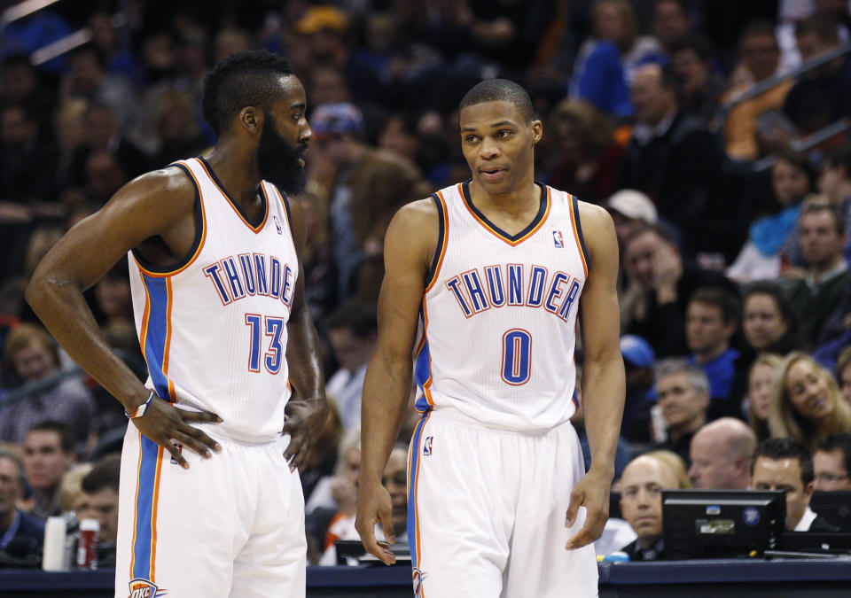 FILE - In this Jan. 25, 2012 file photo Oklahoma City Thunder guard James Harden, left, talks with teammate Russell Westbrook in the fourth quarter of an NBA basketball game in Oklahoma City. The Westbrook-Harden reunion in Houston is a neat story, but both guards have changes to make for the trade to work. They are both "ball dominant" players and getting big-time stars to change is never easy. (AP Photo/Sue Ogrocki, file)