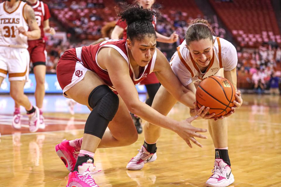 Texas guard Shay Holle and Oklahoma guard Skylar Vann fight for a loose ball during a game at the Frank Erwin Center in 2022. Vann has started in 16 of the 17 games that she's appeared in this season. She's averaging a team-best 14.6 points and 6.9 rebounds per game.
