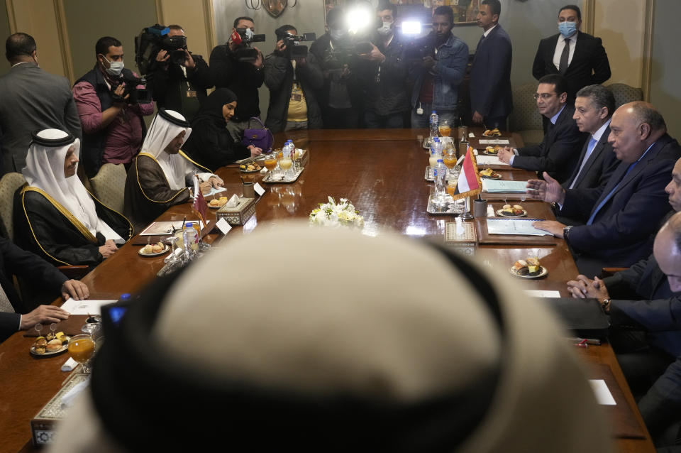 Egyptian Foreign Minister Sameh Shoukry, right, meets with Qatar's Foreign Minister Sheikh Mohammed bin Abdulrahman Al Thani, and his delegations at the foreign ministry headquarters in Cairo, Egypt, Monday, March 28, 2022. (AP Photo/Amr Nabil)
