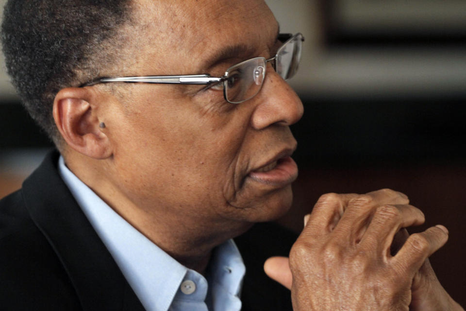 FILE - Jazz pianist and composer Ramsey Lewis describes his composing methods during an interview at his home in Chicago, April 5, 2011. Renowned jazz pianist Lewis, whose music entertained fans over a more than 60-year career that began with the Ramsey Lewis Trio and made him one of the country’s most successful jazz musicians, died Monday, Sept. 12, 2022. He was 87. (AP Photo/M. Spencer Green, File)