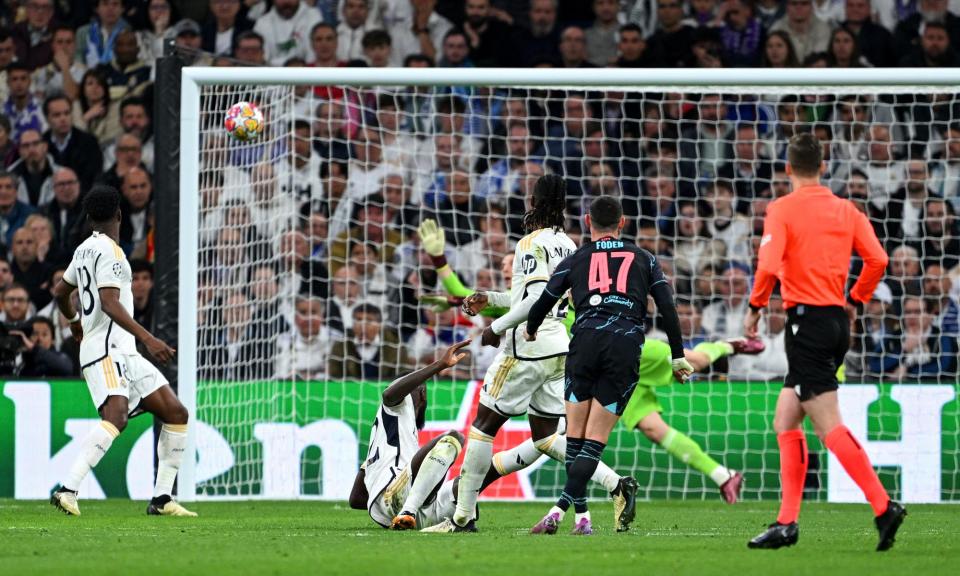 <span>Phil Foden sets himself with a familiar backlift to spank a wonderful shot into the top corner for Manchester City.</span><span>Photograph: David Ramos/Getty Images</span>