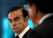 Carlos Ghosn (L), Chairman and CEO of the Renault-Nissan Alliance and Mitsubishi Motors Corp's Chairman and CEO Osamu Masuko attend their joint news conference in Tokyo, Japan, October 20, 2016. REUTERS/Issei Kato