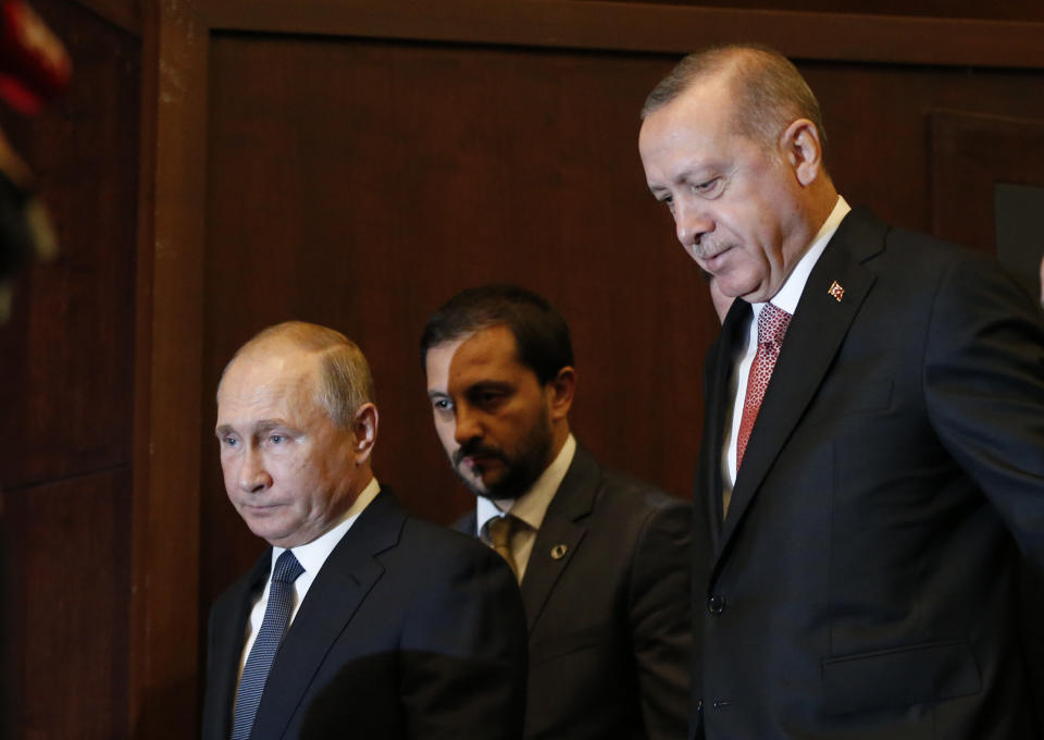 Russian President Vladimir Putin, left, and Turkey's President Recep Tayyip Erdogan, right, arrive to an event marking the completion of one of the phases of the Turkish Stream natural gas pipeline, in Istanbul, Monday, Nov. 19, 2018. (AP Photo/Lefteris Pitarakis)