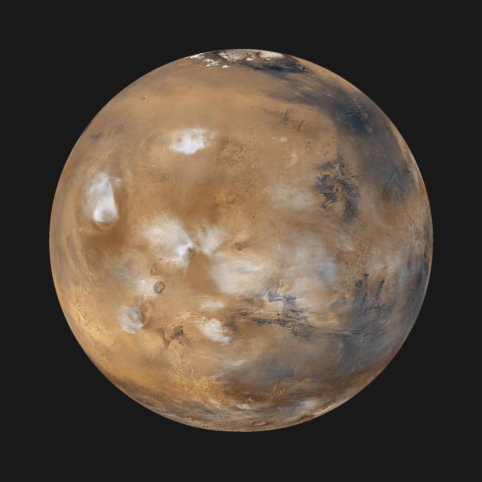 planet mars brown with blue-black and white splotches in the black of space