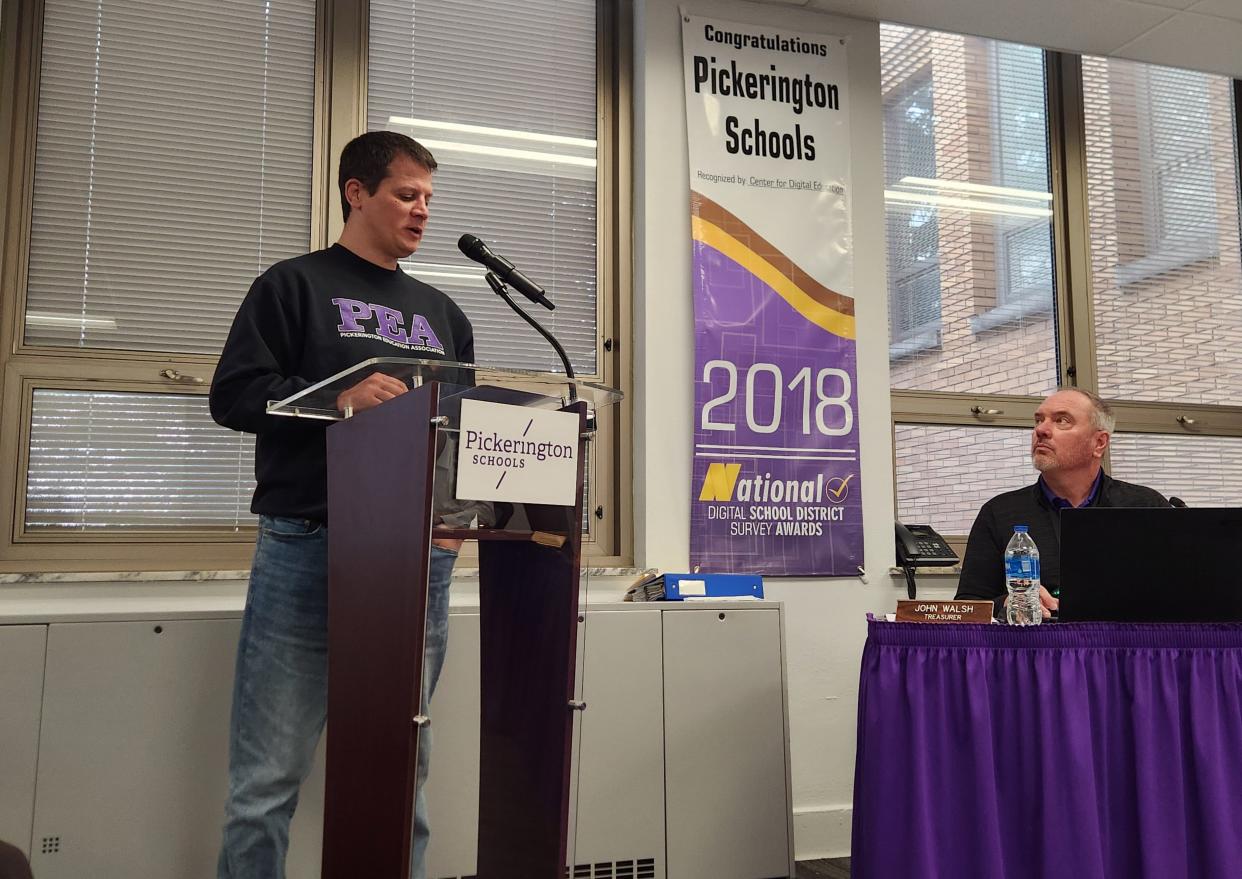Pickerington Education Association President Brad Harris delivers a statement Monday at a Board of Education meeting, after the teachers union voted no-confidence in the school board.