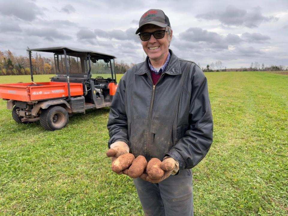 Roger Henry says he was "surprised" at the size of some of the potatoes harvested from the Plowdown Challenge field. 