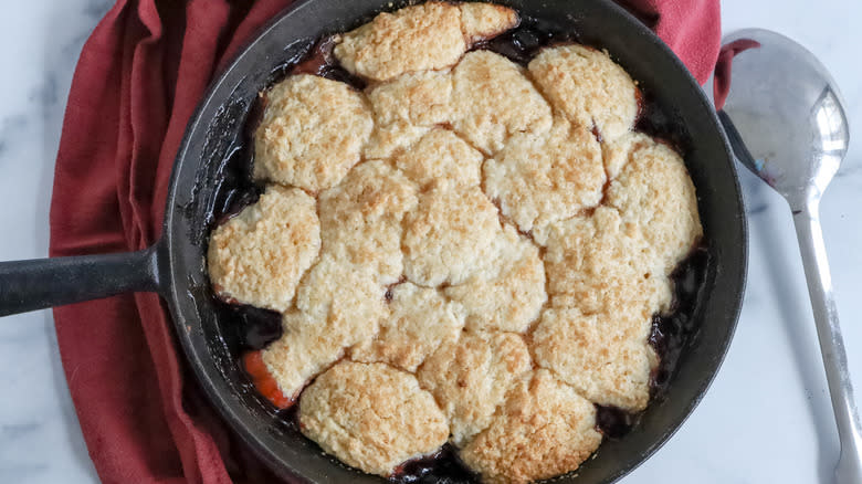 plum cobbler in skillet