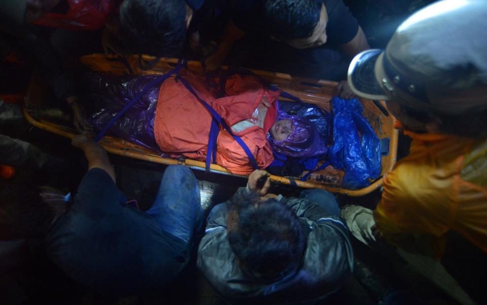 Indonesia rescue team evacuate a victim of the eruption of Mount Marapi on Monday