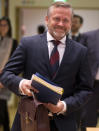 Danish Foreign Minister Anders Samuelsen, center, arrives for a General Affairs Council meeting at the Europa building in Brussels, Tuesday, Dec. 11, 2018. Top European Union officials ruled out Tuesday any renegotiation of the divorce agreement with Britain as Prime Minister Theresa May launched her fight to save her Brexit deal by lobbying leaders in Europe's capitals. (AP Photo/Virginia Mayo)