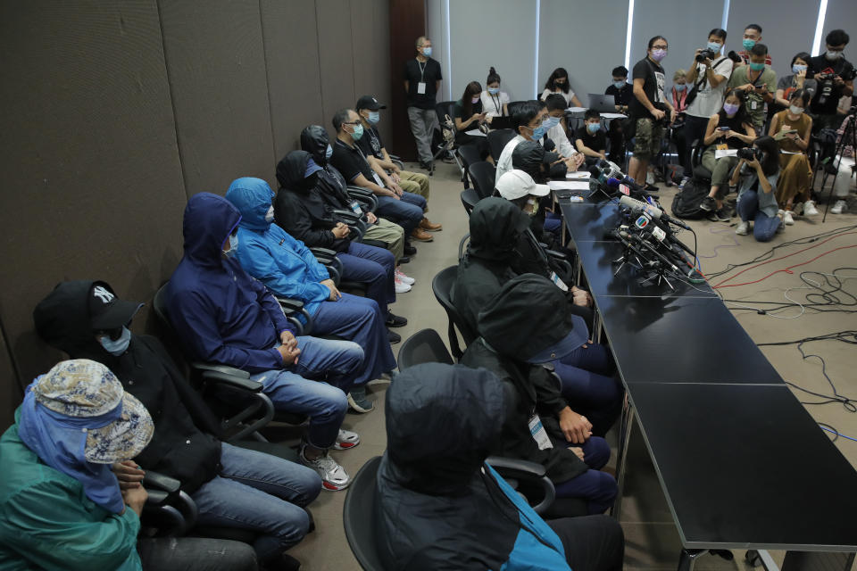 Relatives of 12 Hong Kong activists detained at sea by Chinese authorities attend a press conference in Hong Kong, Saturday, Sept. 12, 2020. They called for their family members to be returned to the territory, saying their legal rights were being violated. (AP Photo/Kin Cheung)