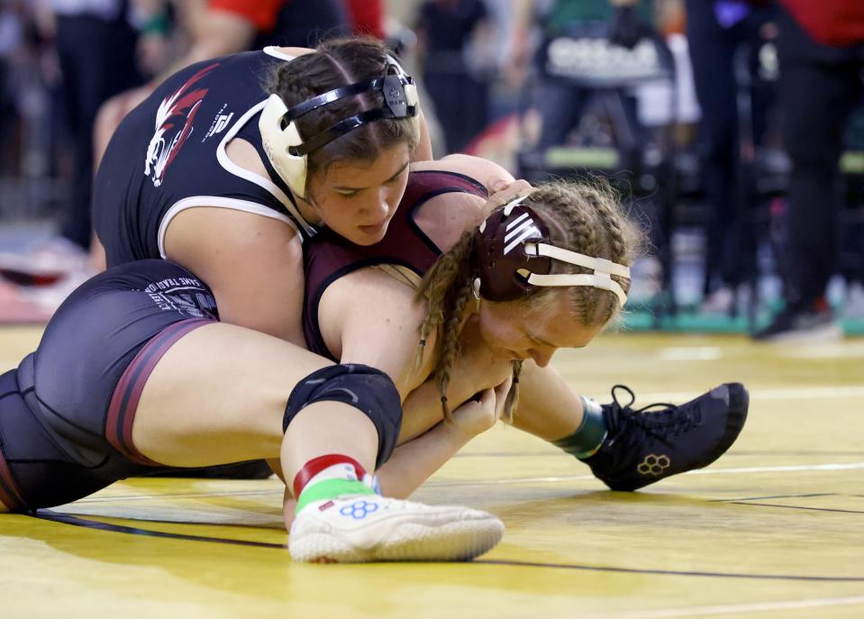 Tuttle's Marlow Folsom, top, wrestles Perry's Audra Coldiron in a girls 5A 155-pound match during the first day of the Oklahoma high school state wrestling tournament in Oklahoma City, Thursday, Feb. 22, 2024.