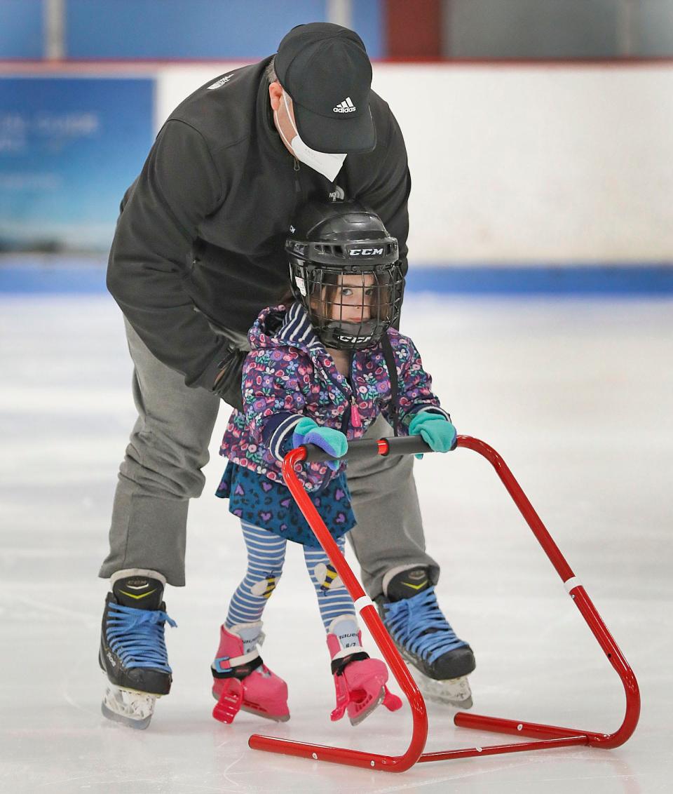 Lulu Magner, 3, and dad Brian gliding on smooth ice at the Rockland Skating Rink Thursday, Jan. 6, 2022.