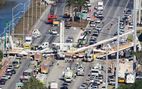 An aerial view shows a pedestrian bridge collapsed at Florida International University in Miami - Credit: Reuters