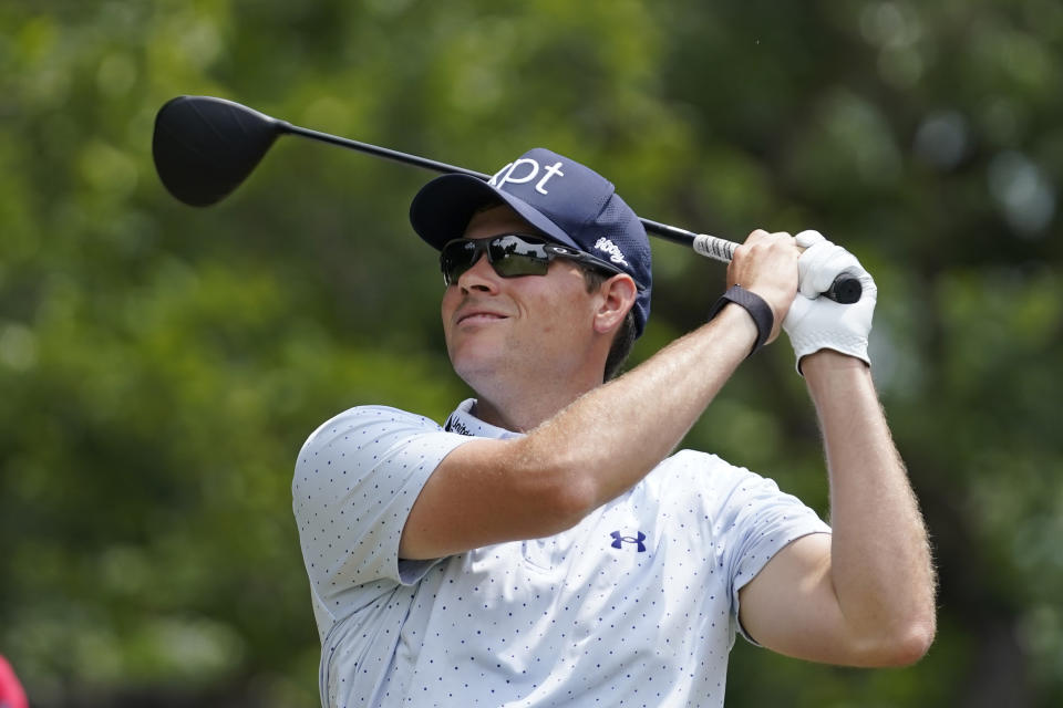 Adam Schenk hits a tee shot on the second hole during the final round of the Charles Schwab Challenge golf tournament at Colonial Country Club in Fort Worth, Texas, Sunday, May 28, 2023. (AP Photo/LM Otero)