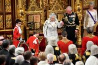 Britain's Queen Elizabeth leaves with Charles, Prince of Wales after delivering the Queen's Speech during the State Opening of Parliament in London